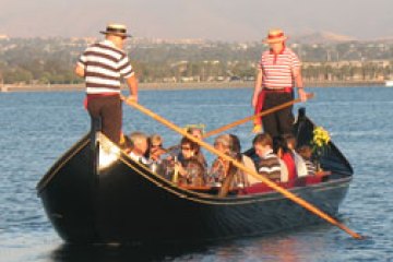a group of people in a small boat in a body of water