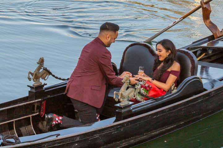 a group of people in a boat on a body of water