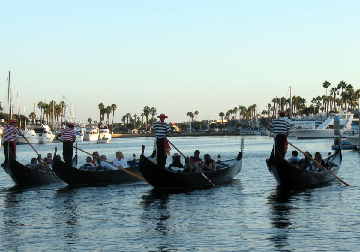 Gondola Fleet Cruise a group of people in a boat on a body of water