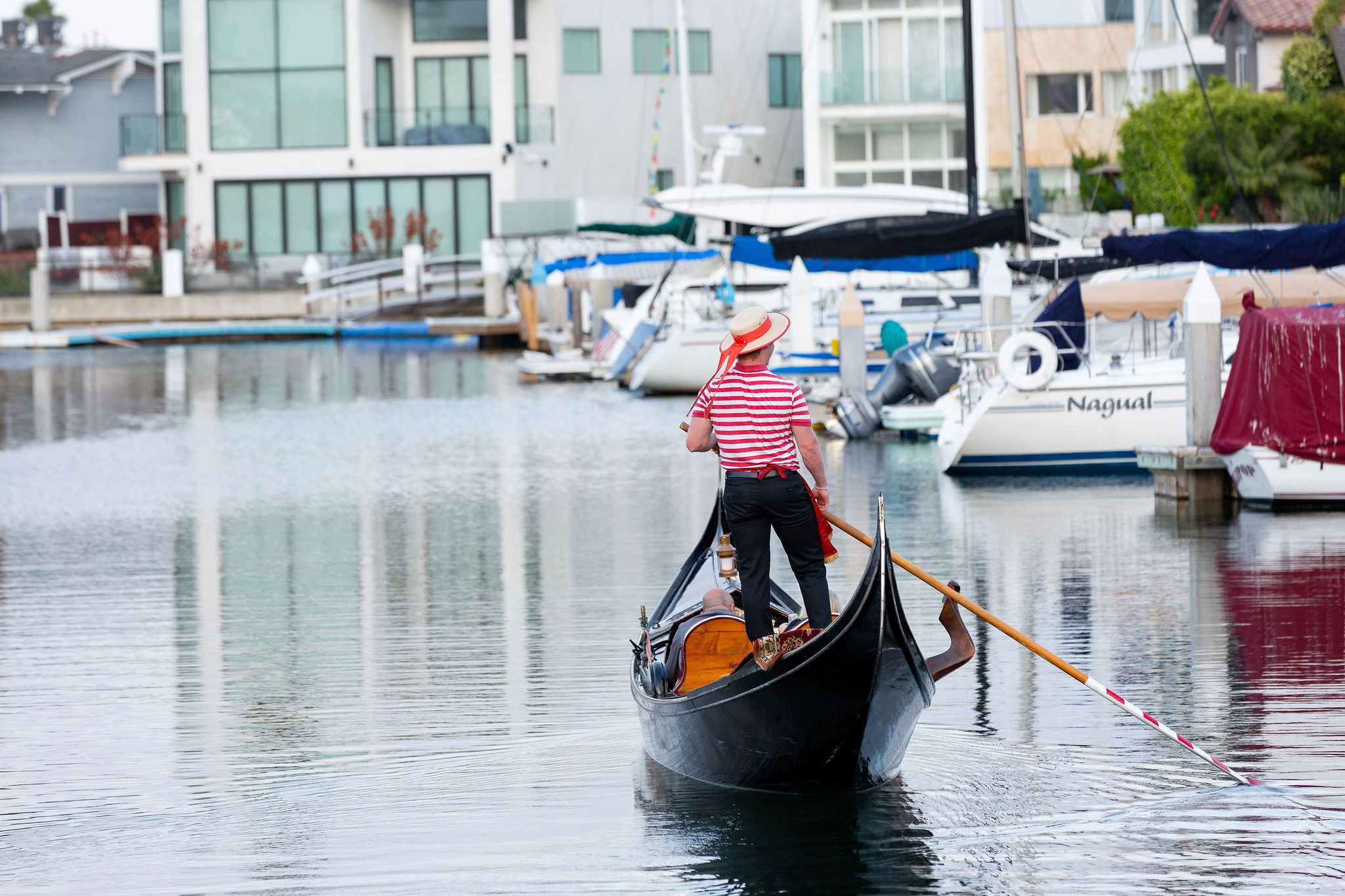 a person riding on the back of a boat in the water