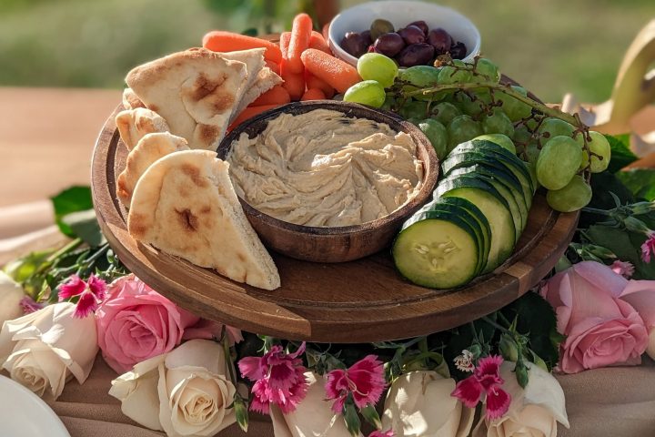 Hummus, Pita, Persian Cucumbers, Carrots, Olives, Seasonal Fruit