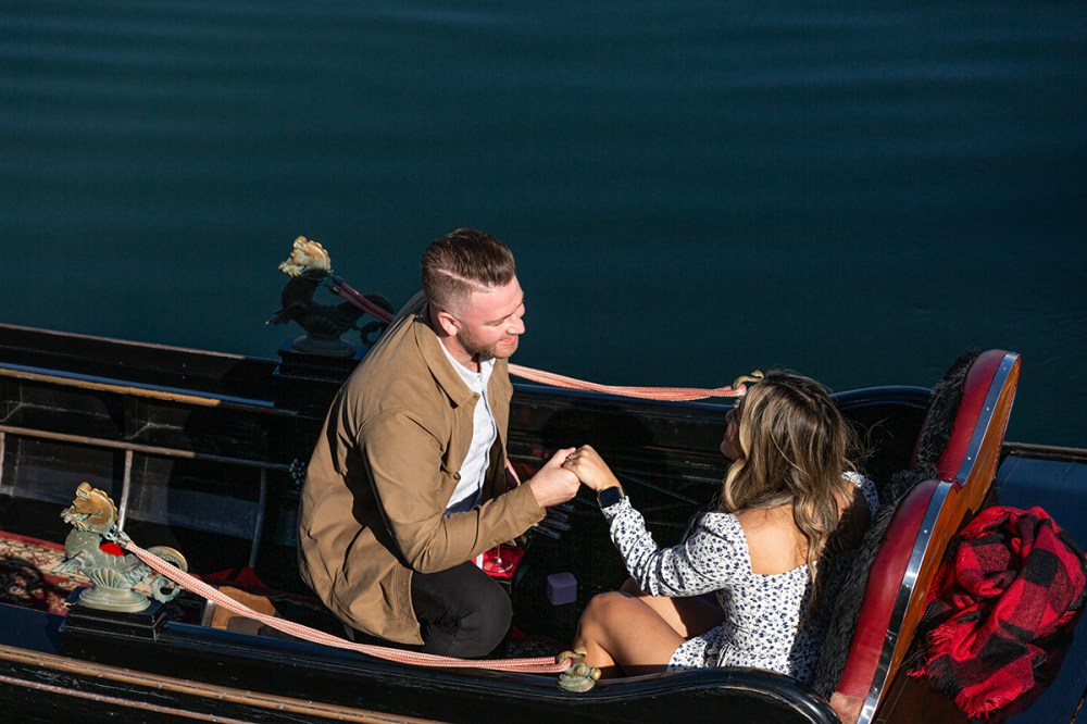 Woman saying yes to a proposal on a gondola in Coronado, San Diego, with joyful emotions.