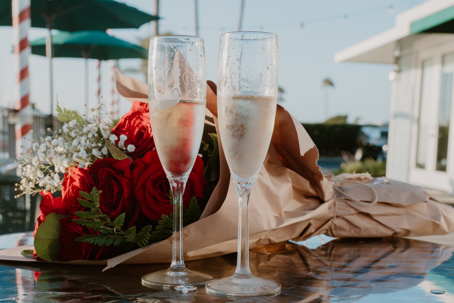 Flutes and a bouquet of red roses ready for a gondola ride in Coronado