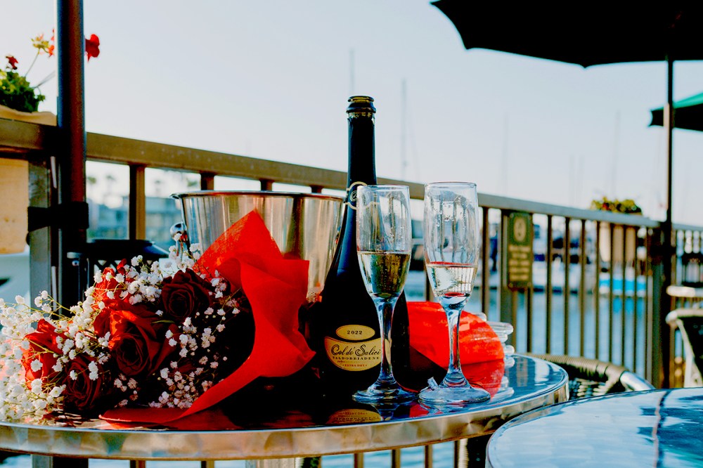 Flowers and prosecco set up for a romantic sunset cruise in San Diego.